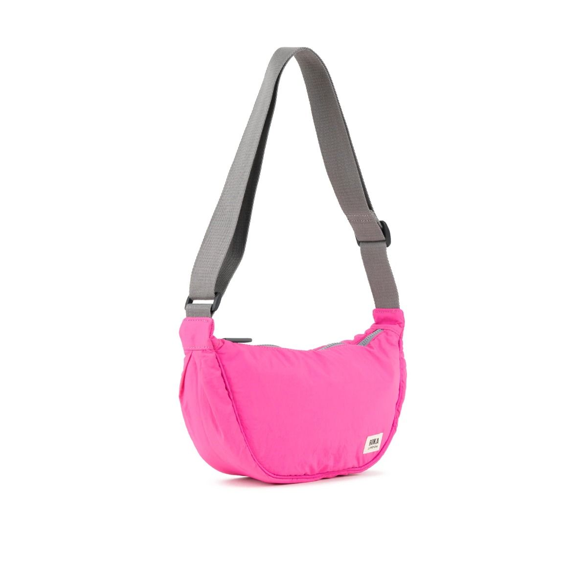 Roka Farringdon Crossbody bag in Hot Pink side. Available at Lotta from Stockholm