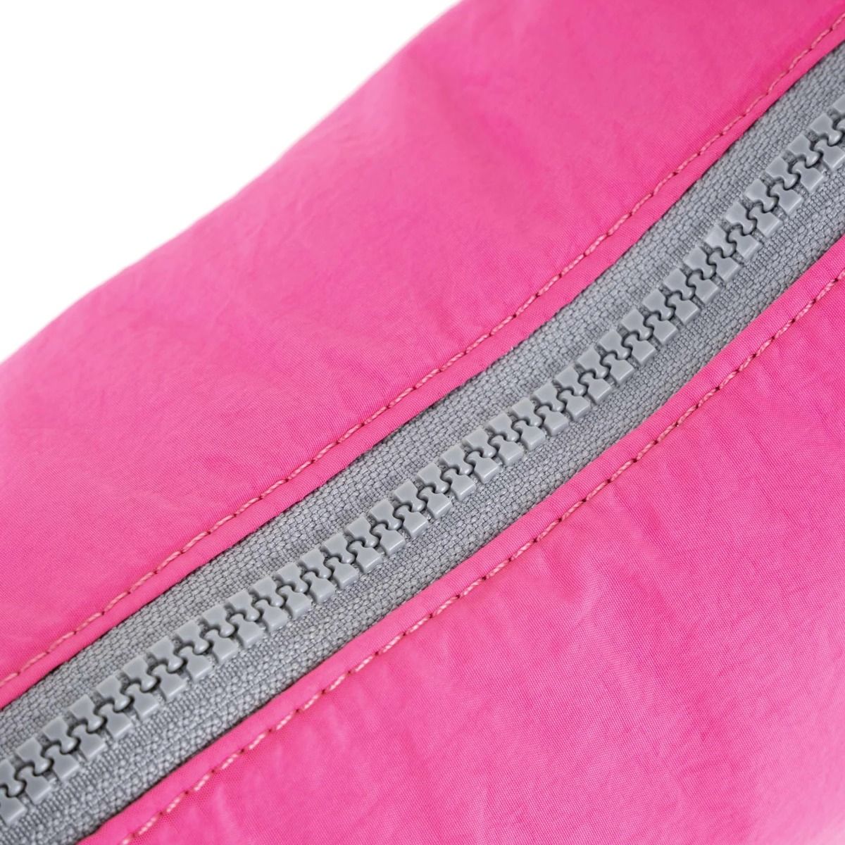 Roka Farringdon Crossbody bag in Hot Pink zip detail. Available at Lotta from Stockholm