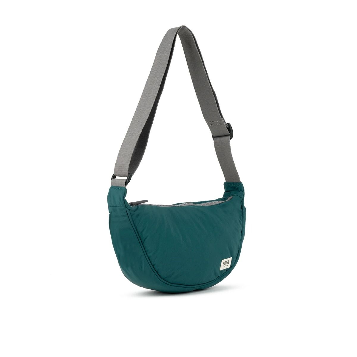 Roka Farringdon Crossbody bag in Teal Side. Available at Lotta from Stockholm